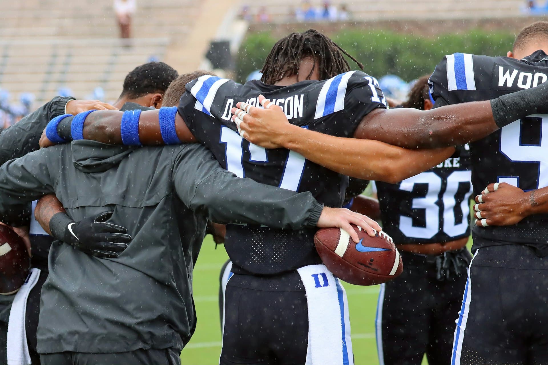 College football team celebrating together